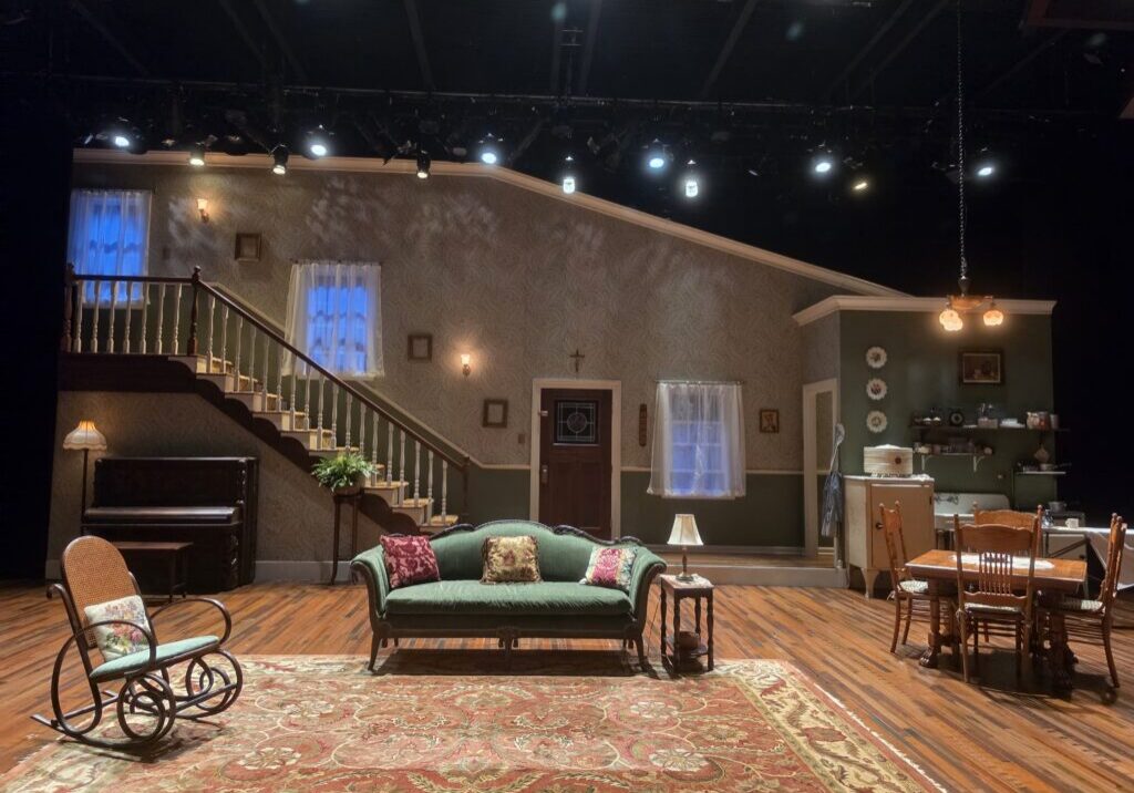 The set of August Wilson's The Piano Lesson at Juilliard's Stephanie P. McClelland Drama Theater: the Charles family parlor in 1936 Pittsburgh, with the upright piano, staircase and kitchen.